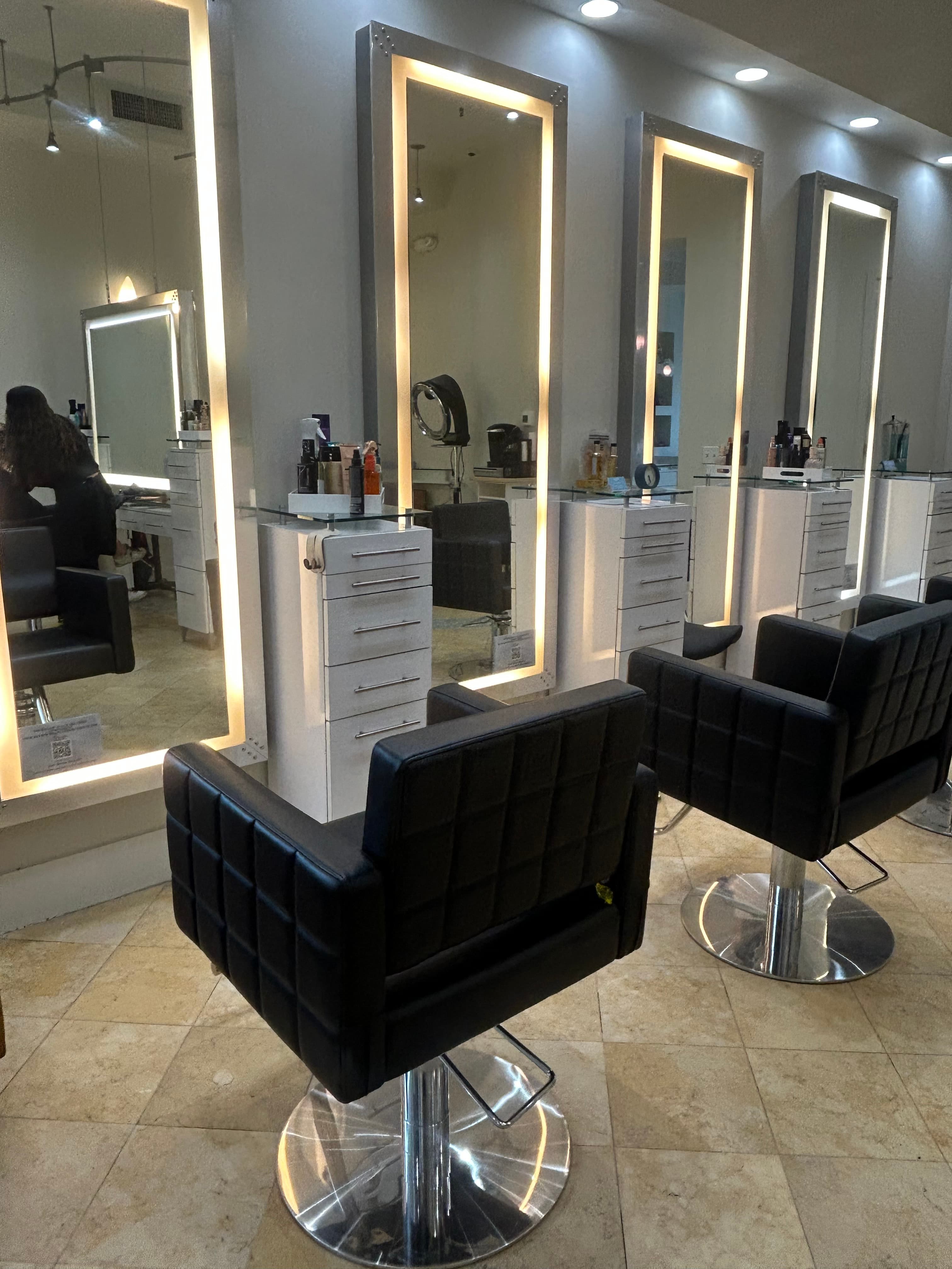Editorial detail of the Ardan salon — mirrors and warm natural light